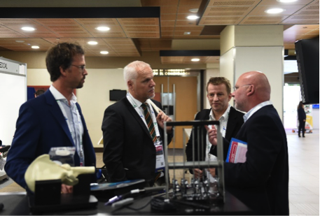 Delegates view innovative products at the industrial exhibition at an ISHA Annual Scientific Meeting