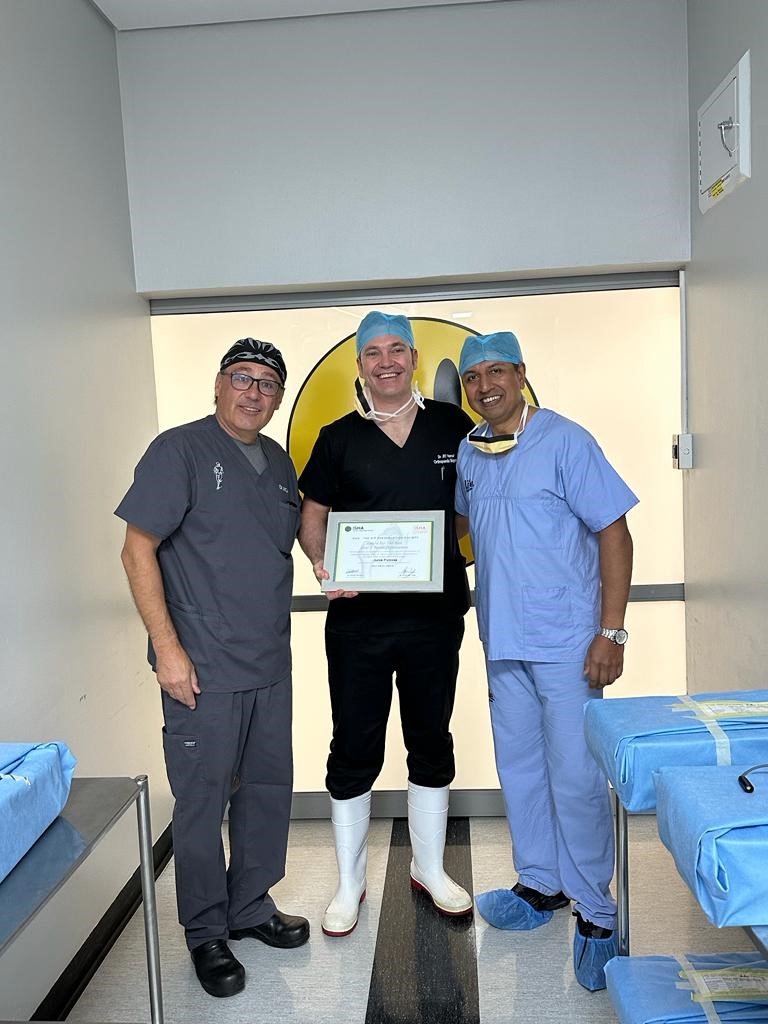 Dr Chuck Cakic and Mr Parminder Singh present an award for excellence in hip preservation research to Dr Jurek Pietrzak following the 2023 Annual Scientific Meeting of ISHA - The Hip Preservation Society in Cape Town, South Africa