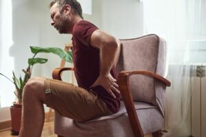 A person experiencing hip pain