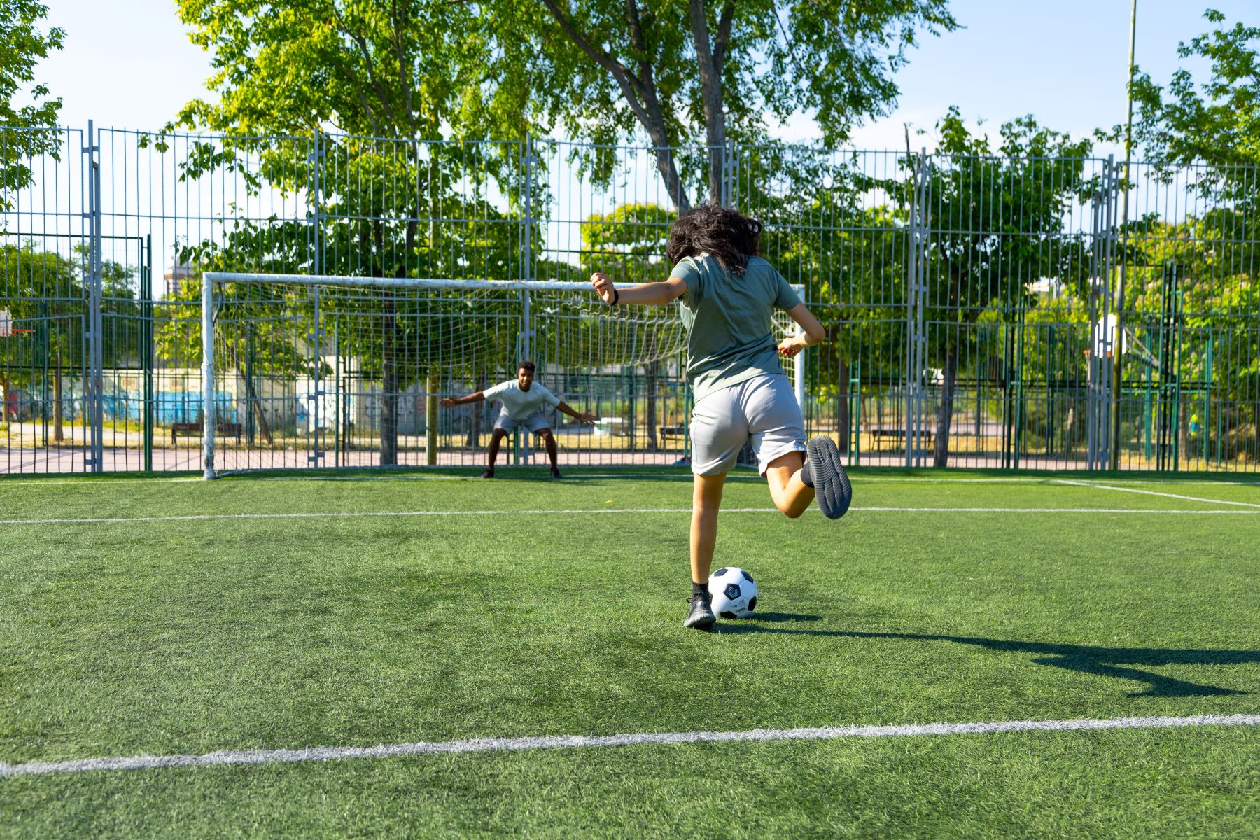 A person kicking a football